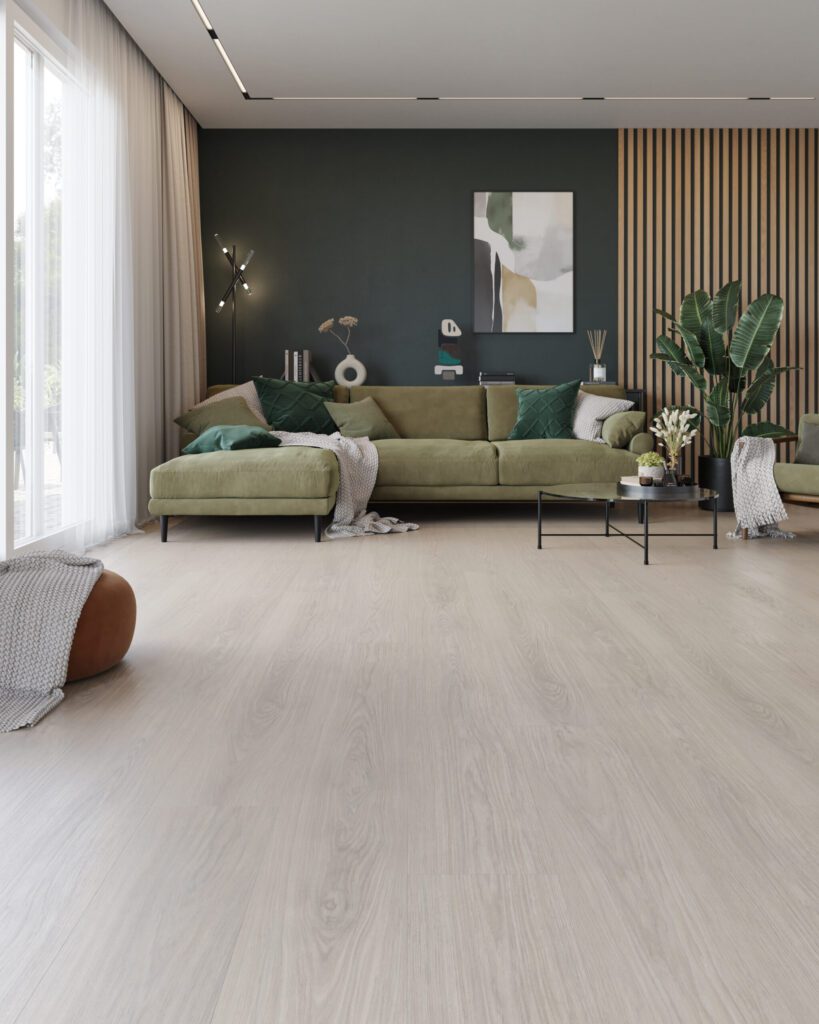 Modern living room with a green sofa, wooden slat wall, and light wood flooring.
