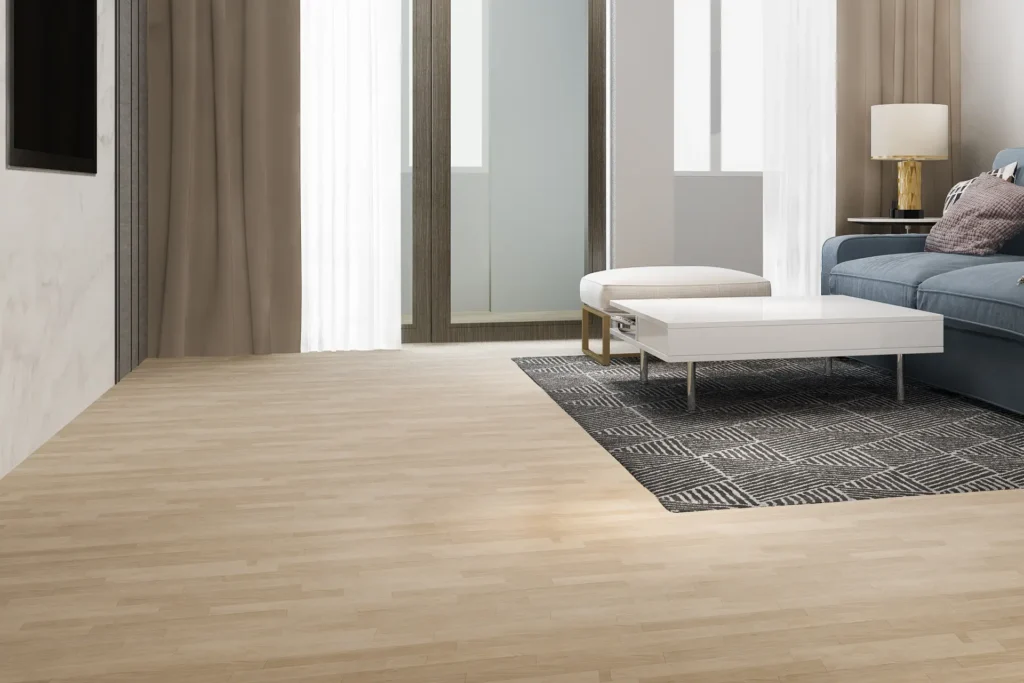 Stylish living room with light wood flooring, a modern coffee table, and neutral-colored curtains.