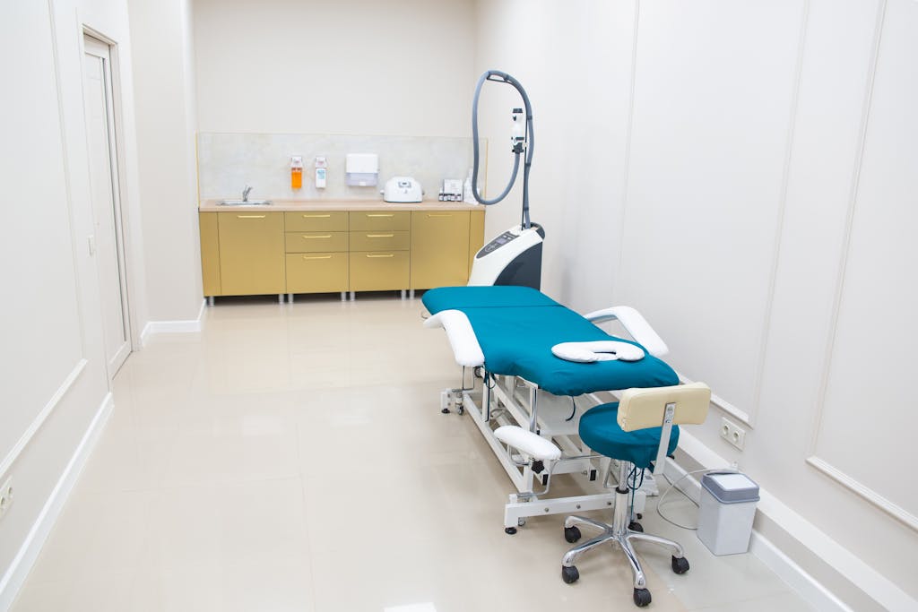 A clean, well-equipped medical examination room with state-of-the-art equipment and sterile environment.