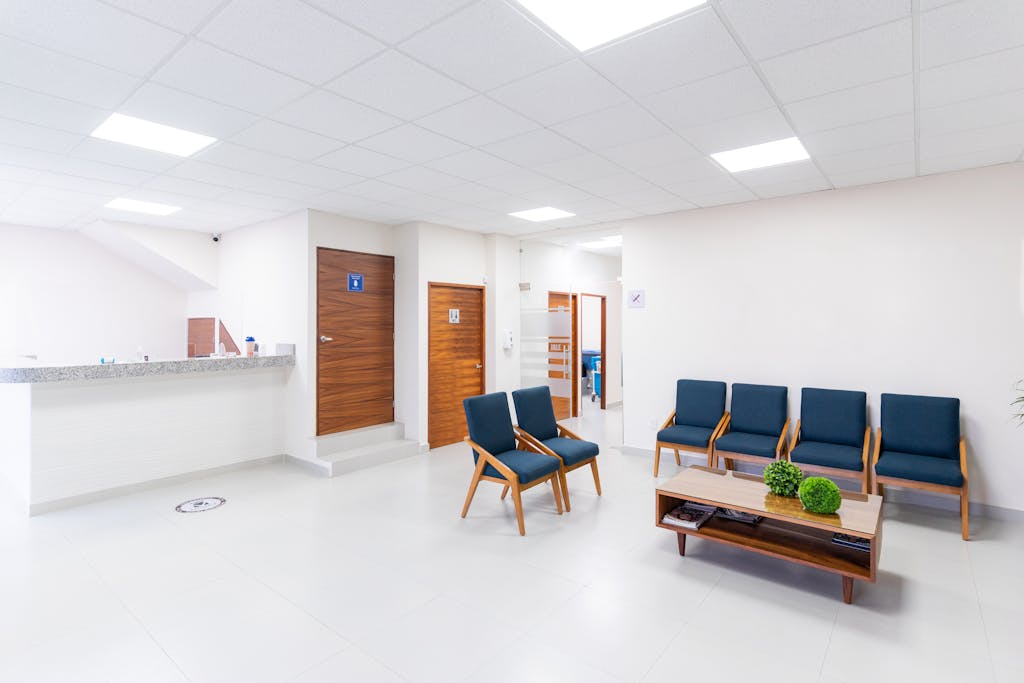 Bright and clean medical waiting room with modern seating and decor.